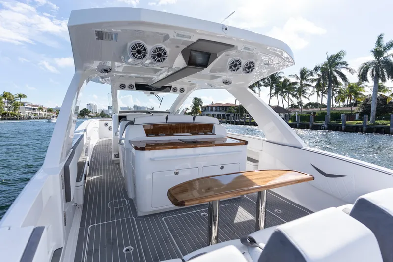 Slide: The Image of Luxury interior of 2026 Deep Impact 499 Sport boat on a sunny waterfront. - 74