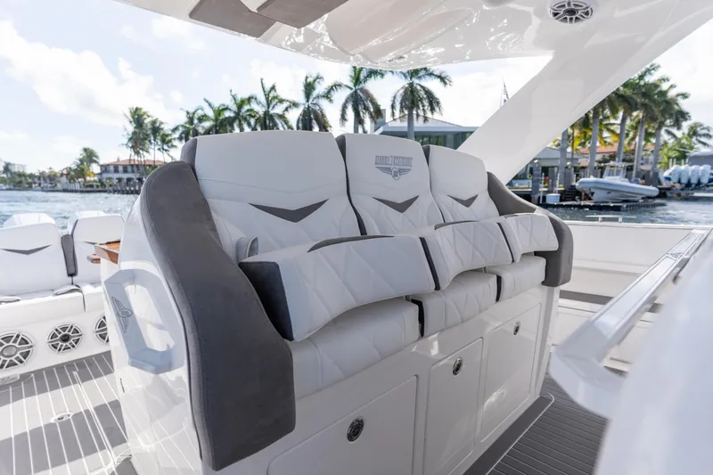 Slide: The Image of Luxury seating on 2026 Deep Impact 499 Sport boat, featuring elegant design and waterfront view. - 78