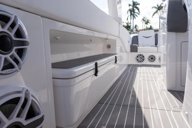 Slide: The Image of Interior of 2026 Deep Impact 499 Sport Luxury Edition boat with sleek seating and speakers. - 85