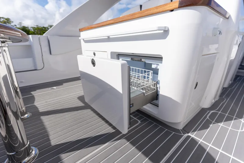Slide: The Image of Open drawer on 2026 Deep Impact 499 Sport Luxury Edition yacht, showcasing sleek design. - 90