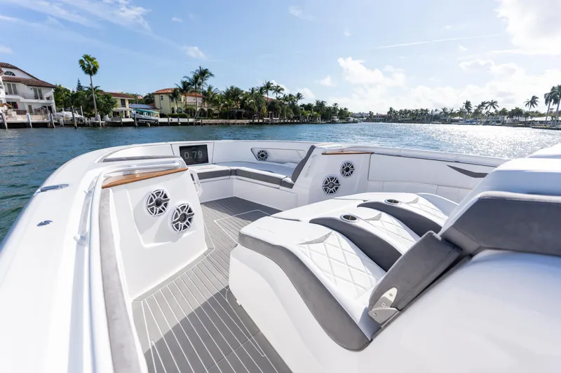 Slide: The Image of Luxurious 2026 Deep Impact 499 Sport boat interior with elegant seating and scenic waterfront view. - 92