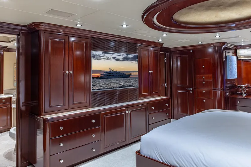 Slide: The Image of Luxurious 2007 Christensen Tri-Deck yacht interior with elegant wood cabinetry and modern decor. - 13