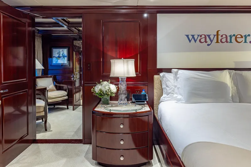 Slide: The Image of Luxurious bedroom interior on 2007 Christensen Tri-Deck yacht, featuring elegant wood furnishings. - 14