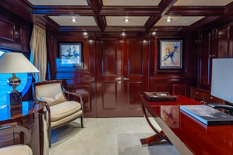 Slide: The Image of Luxurious yacht interior with elegant wood paneling, artwork, and plush seating, Christensen Tri-Deck 2007. - 17