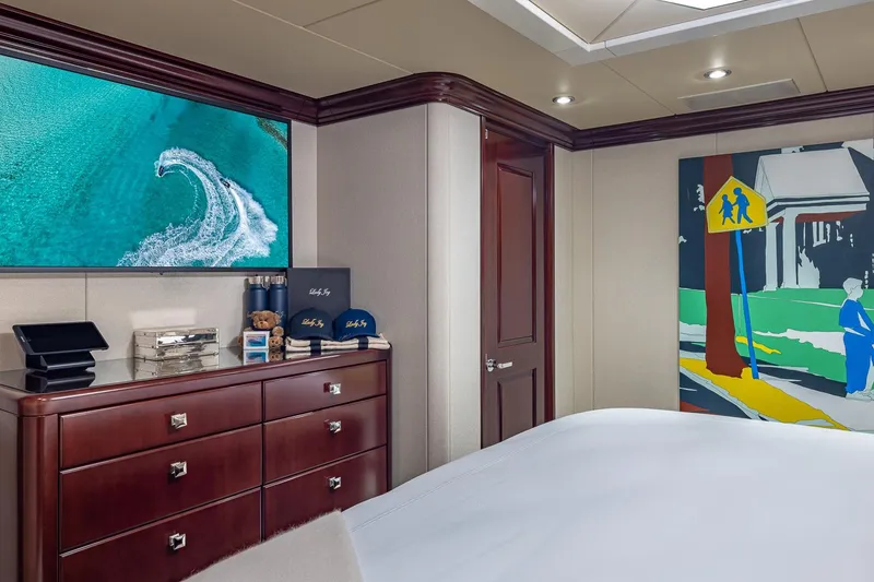 Slide: The Image of Luxurious bedroom interior on 2007 Christensen Tri-Deck yacht with modern art and elegant furnishings. - 22