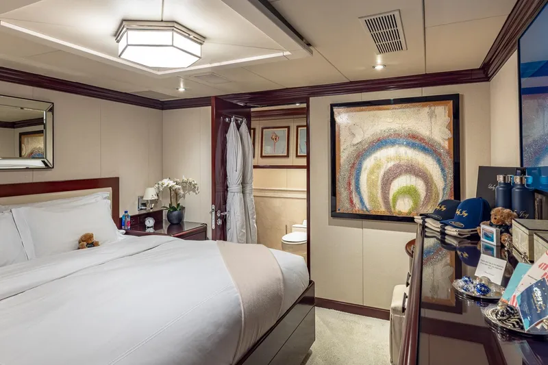 Slide: The Image of Luxurious bedroom on 2007 Christensen Tri-Deck yacht with elegant decor and modern amenities. - 25