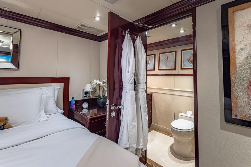 Slide: The Image of Luxurious bedroom and bathroom on 2007 Christensen Tri-Deck yacht, featuring elegant decor and amenities. - 26