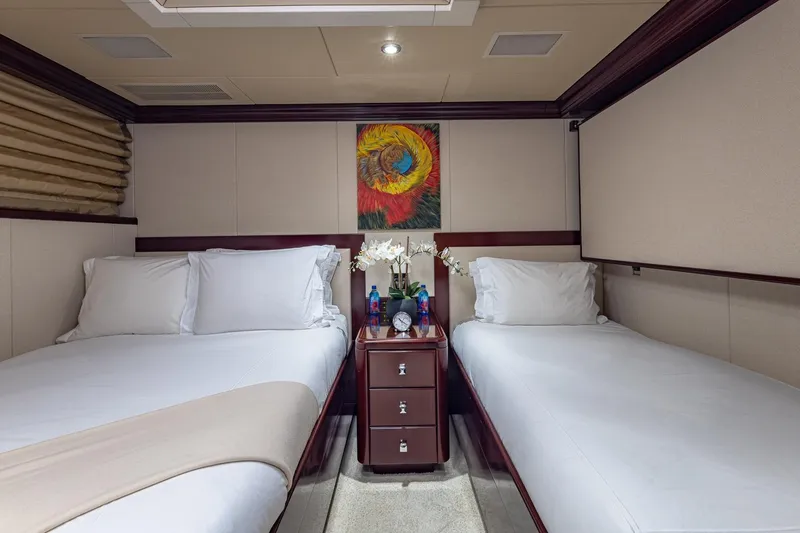 Slide: The Image of Luxurious twin bedroom on 2007 Christensen Tri-Deck yacht with elegant decor and artwork. - 27