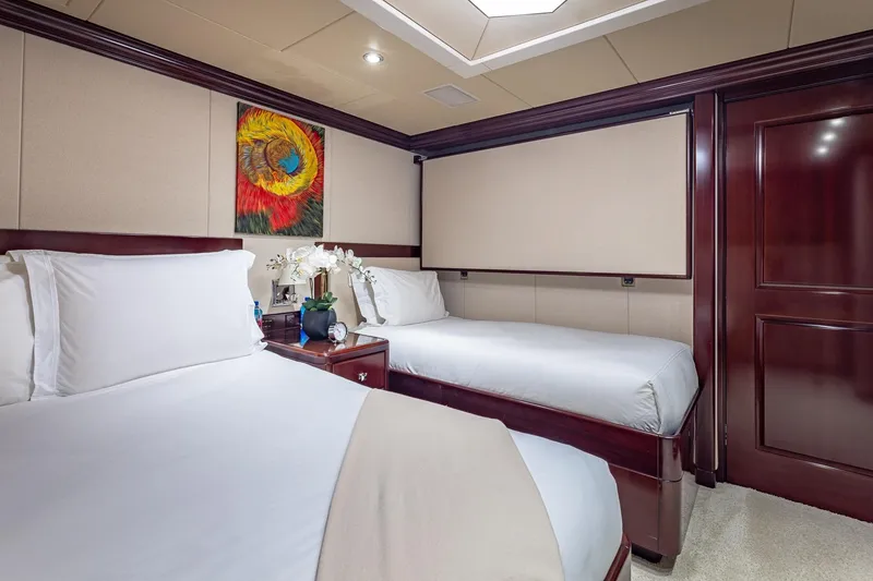Slide: The Image of Luxurious twin bedroom on 2007 Christensen Tri-Deck yacht with elegant decor and artwork. - 28