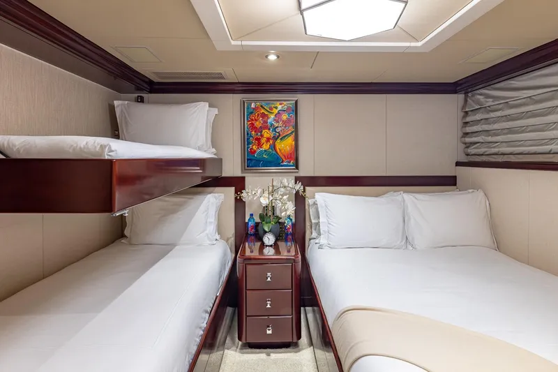Slide: The Image of Luxurious 2007 Christensen Tri-Deck yacht cabin with elegant bedding and vibrant artwork. - 29