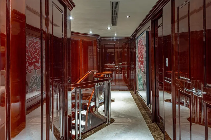 Slide: The Image of Luxurious interior of 2007 Christensen Tri-Deck yacht with polished wood and elegant staircase. - 38