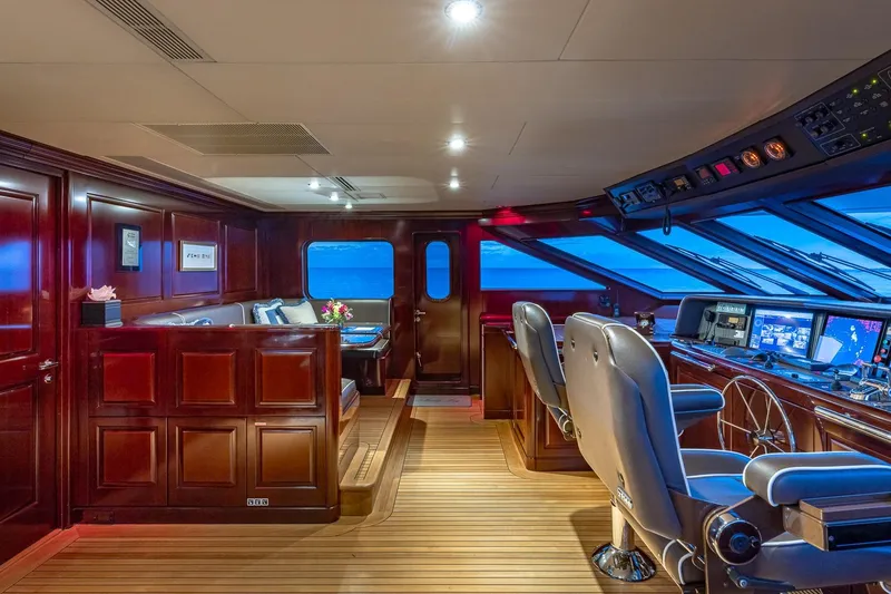 Slide: The Image of Luxurious 2007 Christensen Tri-Deck yacht interior with elegant wood paneling and advanced navigation equipment. - 39