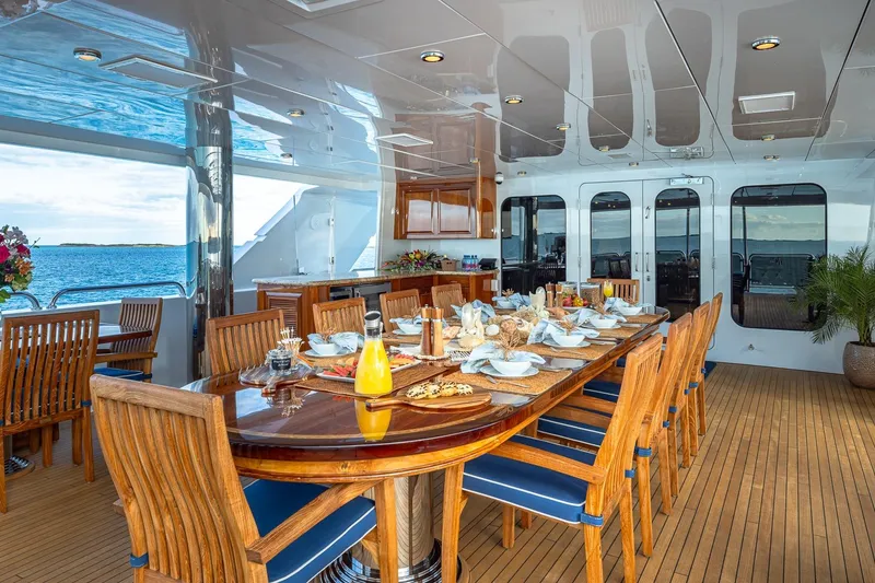 Slide: The Image of Luxurious dining area on 2007 Christensen Tri-Deck yacht with ocean view. - 43