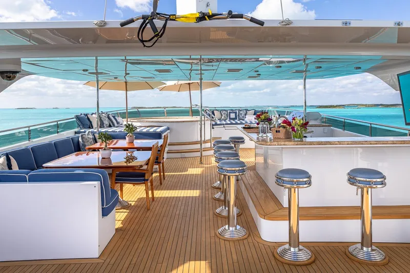 Slide: The Image of Luxurious 2007 Christensen Tri-Deck yacht with elegant outdoor seating and bar area. - 45