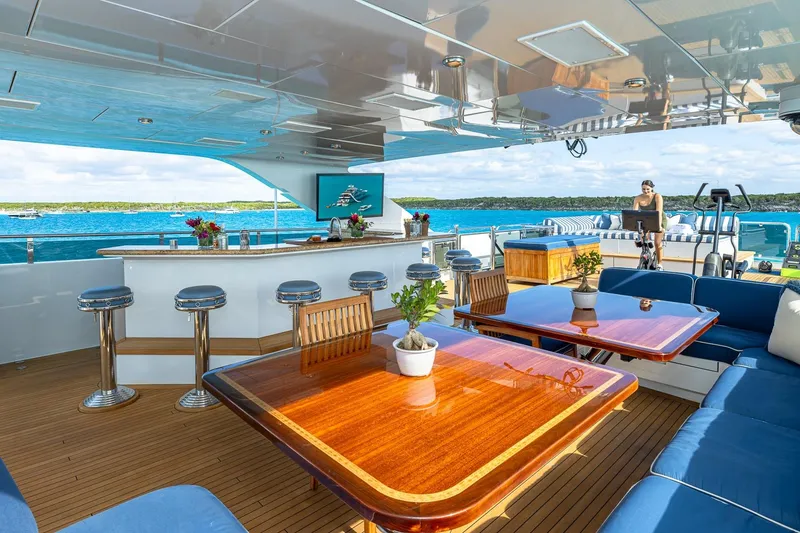 Slide: The Image of Luxurious 2007 Christensen Tri-Deck yacht with elegant outdoor seating and bar area. - 48