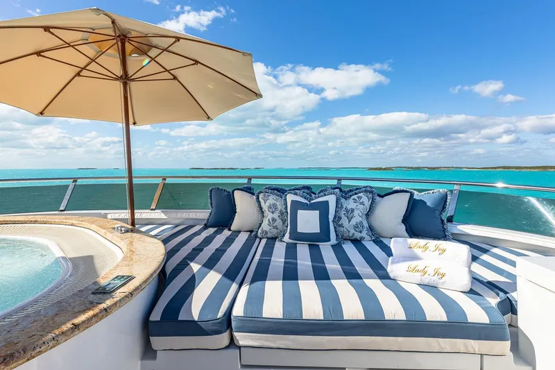 Slide: The Image of Luxurious 2007 Christensen Tri-Deck yacht deck with striped lounge and ocean view. - 51