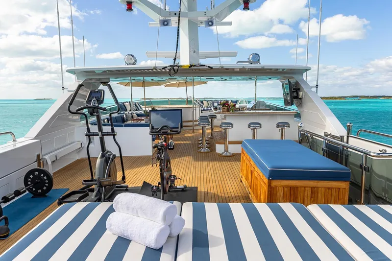 Slide: The Image of Luxurious 2007 Christensen Tri-Deck yacht deck with gym equipment and ocean view. - 52