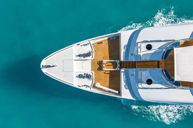 Slide: The Image of Aerial view of 2007 Christensen Tri-Deck yacht cruising in clear turquoise waters. - 57