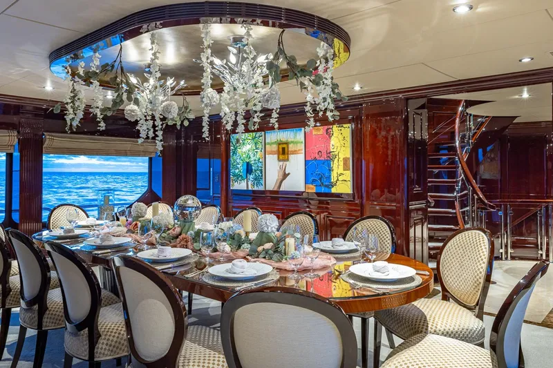 Slide: The Image of Luxurious dining area on 2007 Christensen Tri-Deck yacht with elegant decor and ocean view. - 6