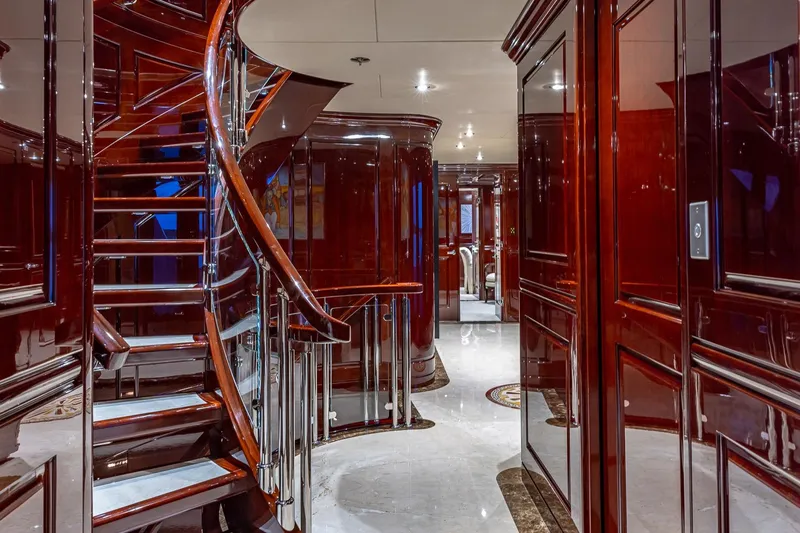 Slide: The Image of Luxurious interior of 2007 Christensen Tri-Deck yacht with elegant wooden staircase and polished finishes. - 8