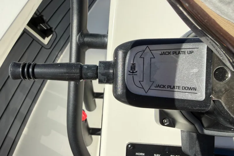 Slide: The Image of 2026 Maverick 17 HPX-S jack plate control lever with up and down arrows. - 19