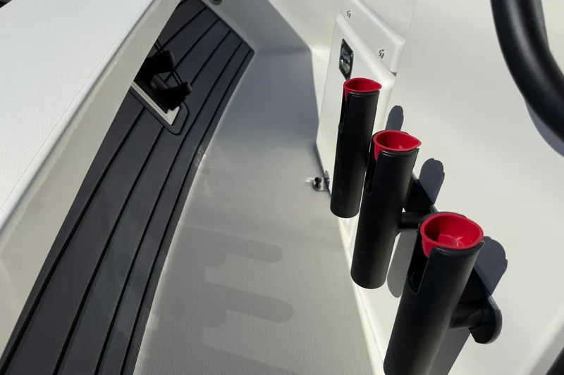 Slide: The Image of 2026 Maverick 17 HPX-S boat interior with rod holders and sleek design. - 22