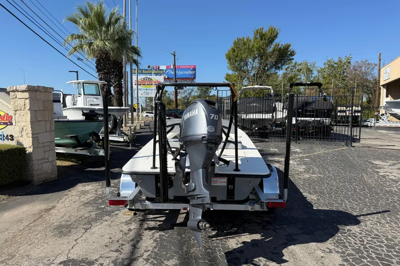 Slide: The Image of 2026 Maverick 17 HPX-S boat with Yamaha motor in a marina parking lot. - 3