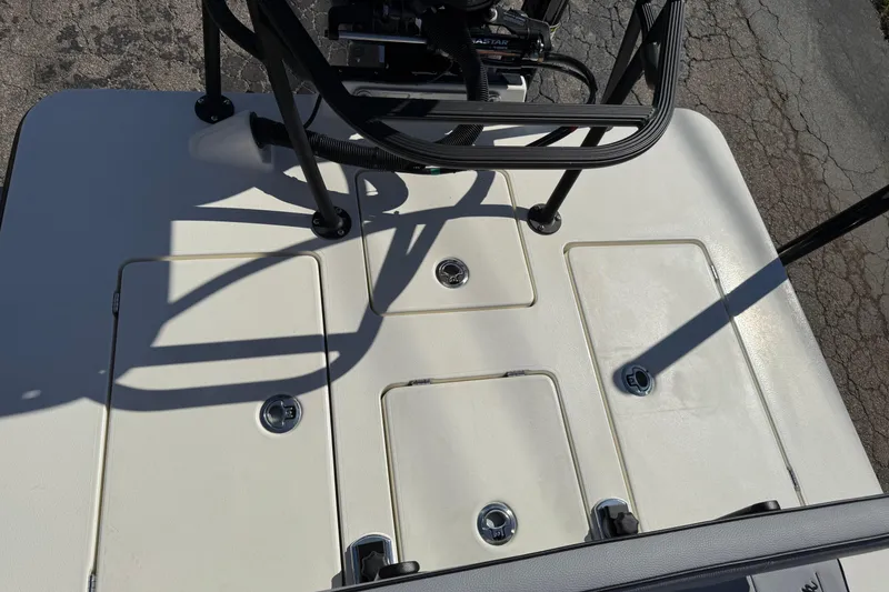 Slide: The Image of 2026 Maverick 17 HPX-S boat deck with storage compartments and steering console. - 30