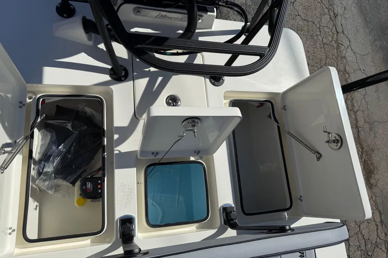 Slide: The Image of 2026 Maverick 17 HPX-S boat storage compartments with open hatches and visible equipment. - 31