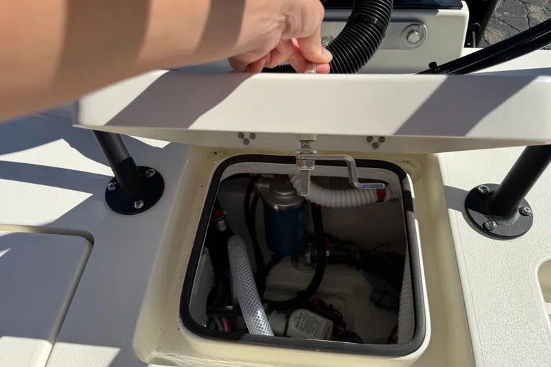 Slide: The Image of 2026 Maverick 17 HPX-S boat compartment with open hatch and visible wiring. - 33