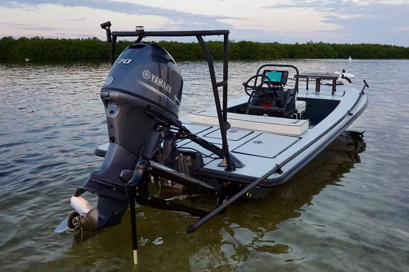 Slide: The Image of Manufacturer Provided Image: 2026 Maverick 17 HPX-S boat with Yamaha engine in shallow water, scenic background. - 35