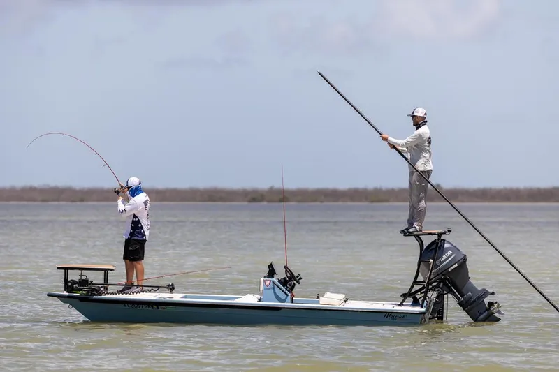 Slide: The Image of Manufacturer Provided Image: Two people fishing on a 2026 Maverick 17 HPX-S boat in shallow waters. - 36