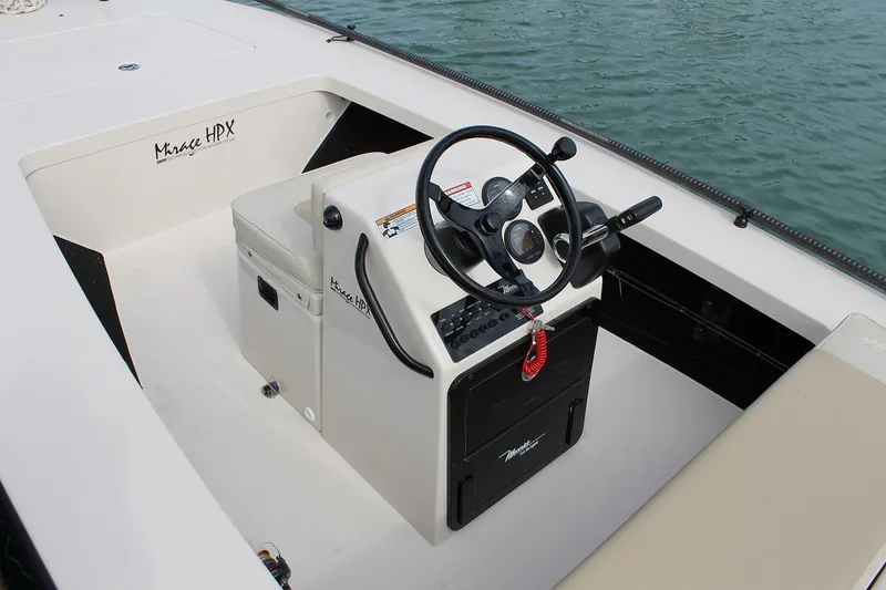 Slide: The Image of Manufacturer Provided Image: 2026 Maverick 17 HPX-S boat console with steering wheel, on calm water. - 37