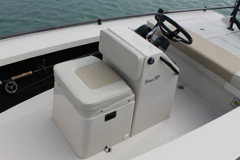 Slide: The Image of Manufacturer Provided Image: 2026 Maverick 17 HPX-S boat interior with steering console and cushioned seating. - 38