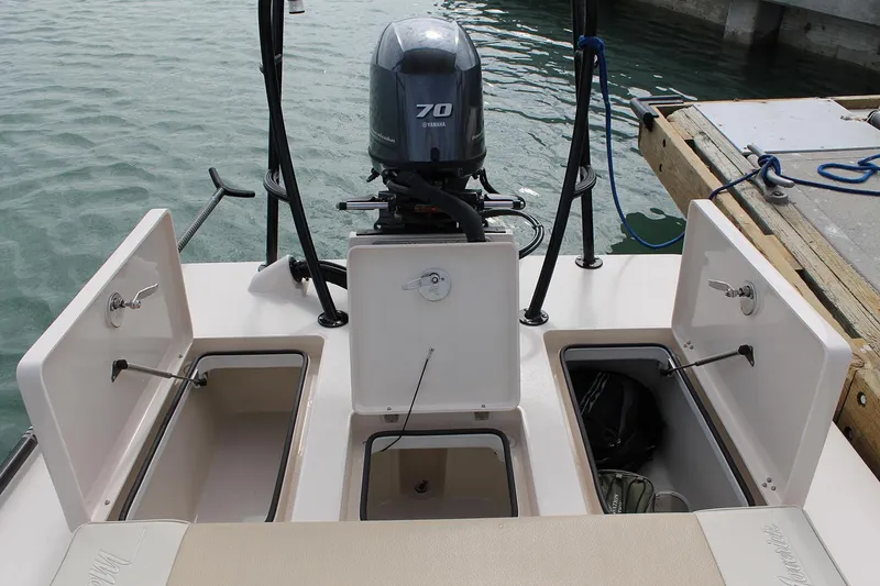 Slide: The Image of Manufacturer Provided Image: 2026 Maverick 17 HPX-S boat with open storage compartments and 70 HP outboard motor. - 40