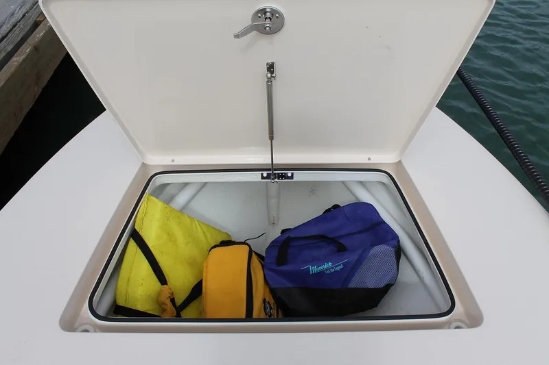 Slide: The Image of Manufacturer Provided Image: Open storage compartment on 2026 Maverick 17 HPX-S boat with bags inside. - 41