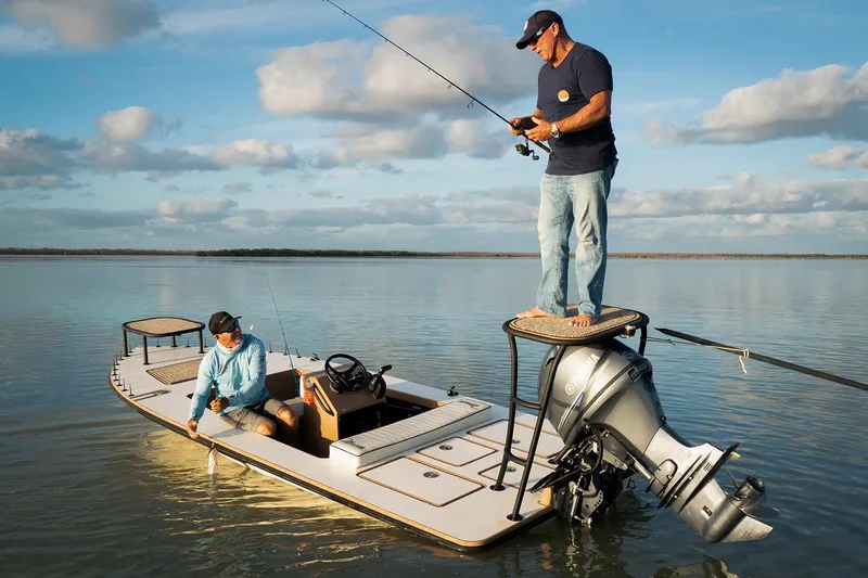 Slide: The Image of Manufacturer Provided Image: Two people fishing on a 2026 Maverick 17 HPX-S boat in calm waters. - 44
