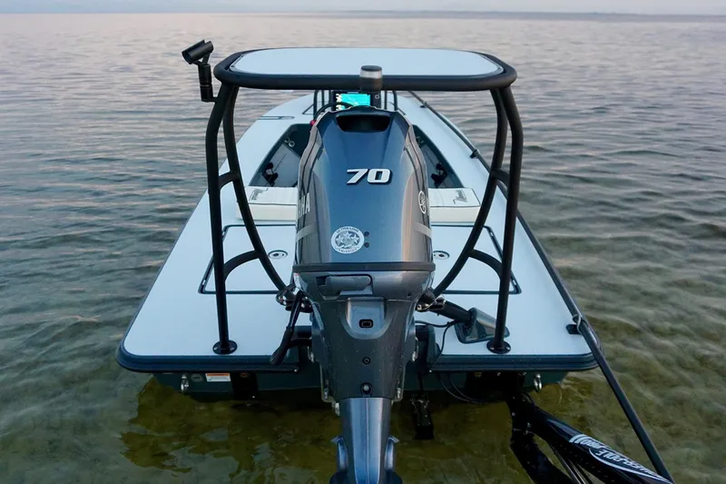 Slide: The Image of Manufacturer Provided Image: 2026 Maverick 17 HPX-S boat with outboard motor on calm water. - 45