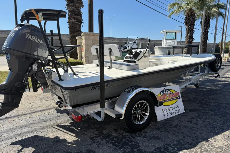 Slide: The Image of 2026 Maverick 17 HPX-S boat with Yamaha engine on trailer, parked outdoors. - 46