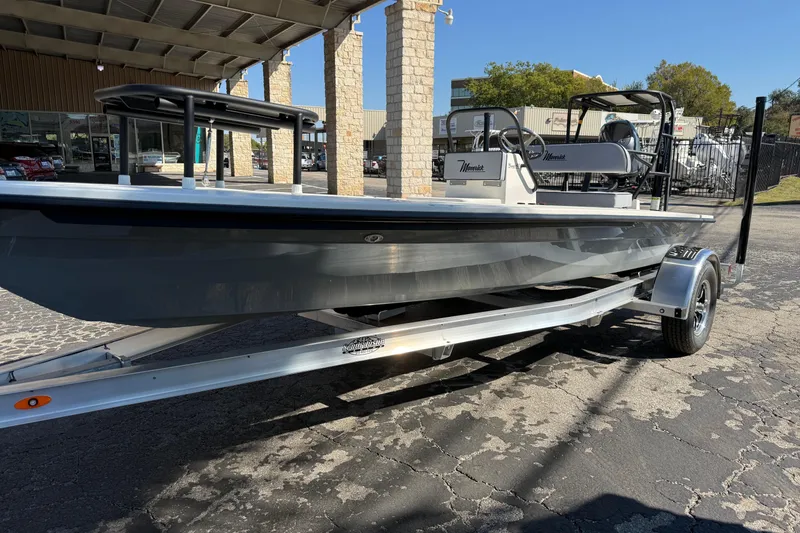 Slide: The Image of 2026 Maverick 17 HPX-S boat on trailer, parked outdoors under a canopy. - 6