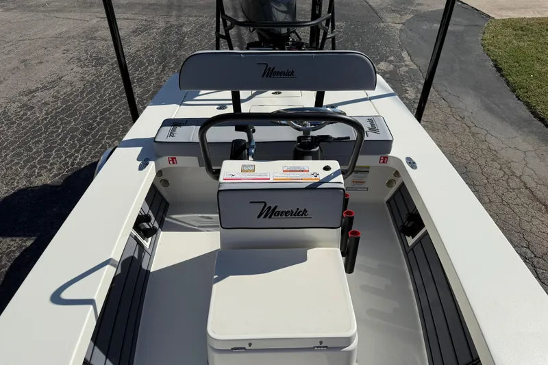 Slide: The Image of 2026 Maverick 17 HPX-S boat interior with steering console and seating. - 8
