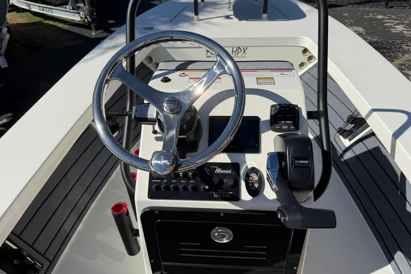 Slide: The Image of 2026 Maverick 17 HPX-S boat console with steering wheel and Yamaha controls. - 9