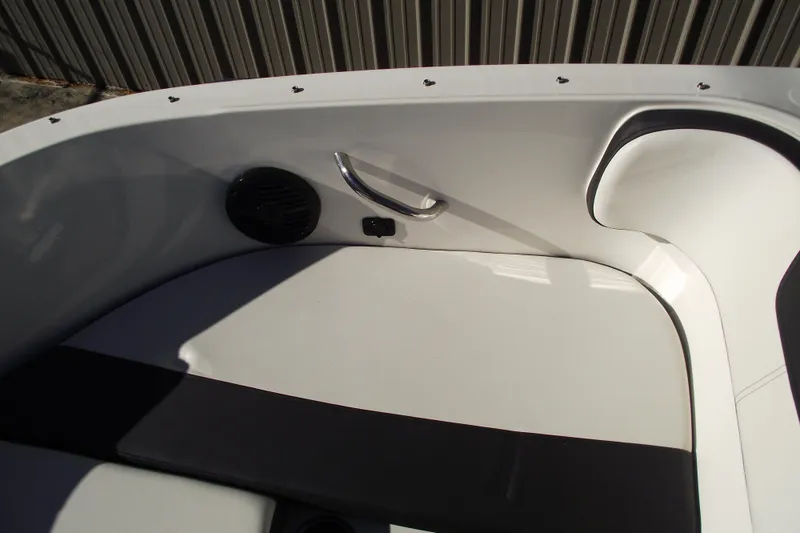 Slide: The Image of 2022 Bayliner VR4 Bowrider OB interior seating with speaker and handle. - 12