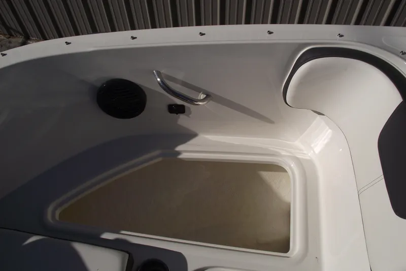 Slide: The Image of 2022 Bayliner VR4 Bowrider OB interior detail with storage compartment and seating. - 13