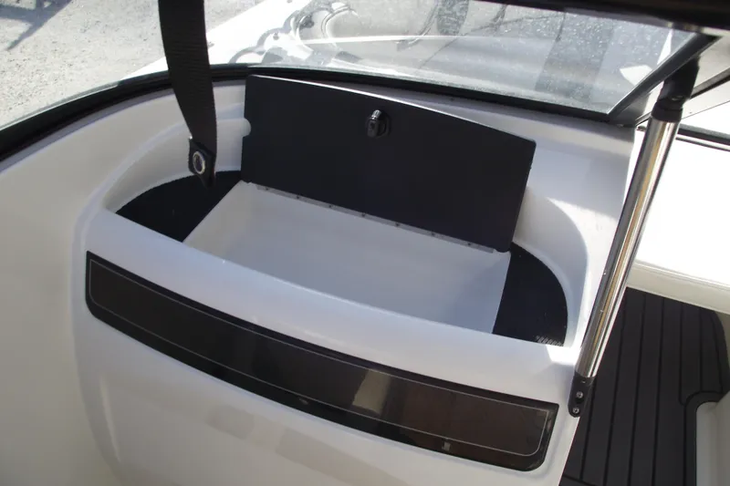 Slide: The Image of 2022 Bayliner VR4 Bowrider OB interior storage compartment with open lid. - 17