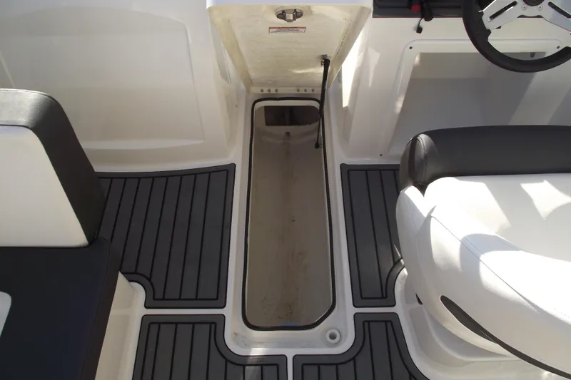 Slide: The Image of 2022 Bayliner VR4 Bowrider OB interior with open storage compartment and seating. - 20