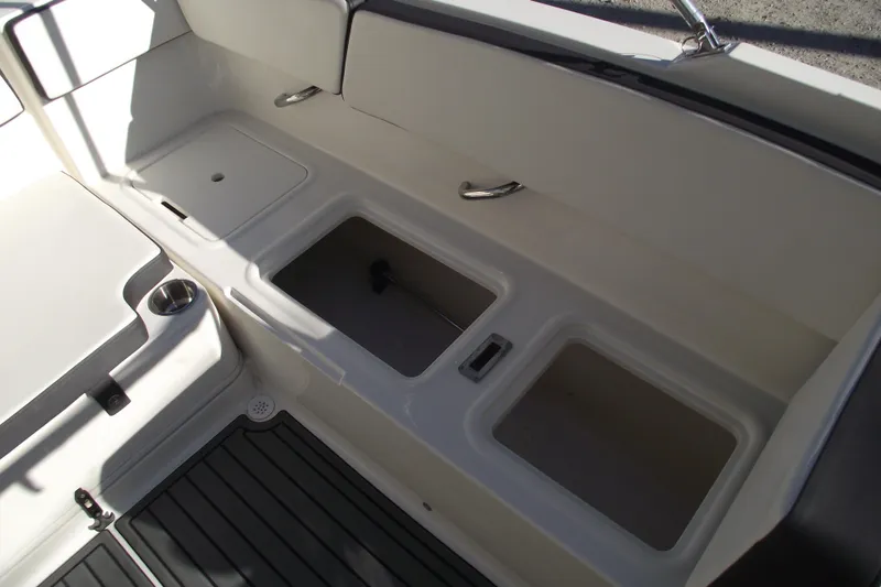 Slide: The Image of 2022 Bayliner VR4 Bowrider OB interior storage compartments and seating area. - 23