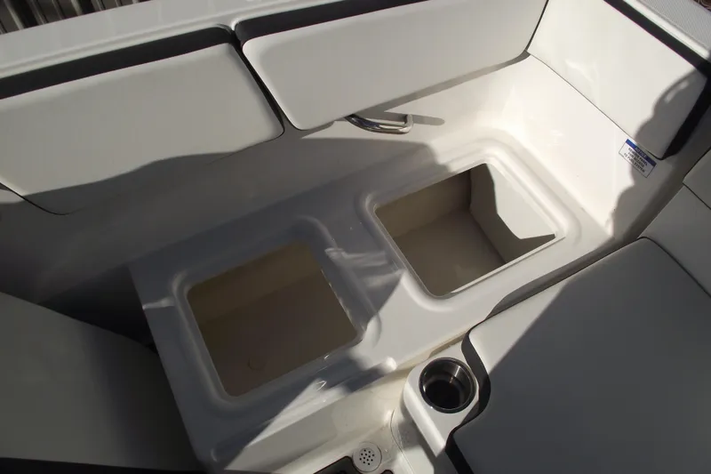 Slide: The Image of 2022 Bayliner VR4 Bowrider OB interior storage compartments and cup holder. - 25