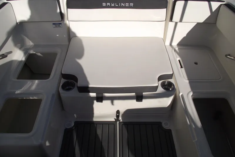Slide: The Image of 2022 Bayliner VR4 Bowrider OB interior with seating and storage compartments. - 26