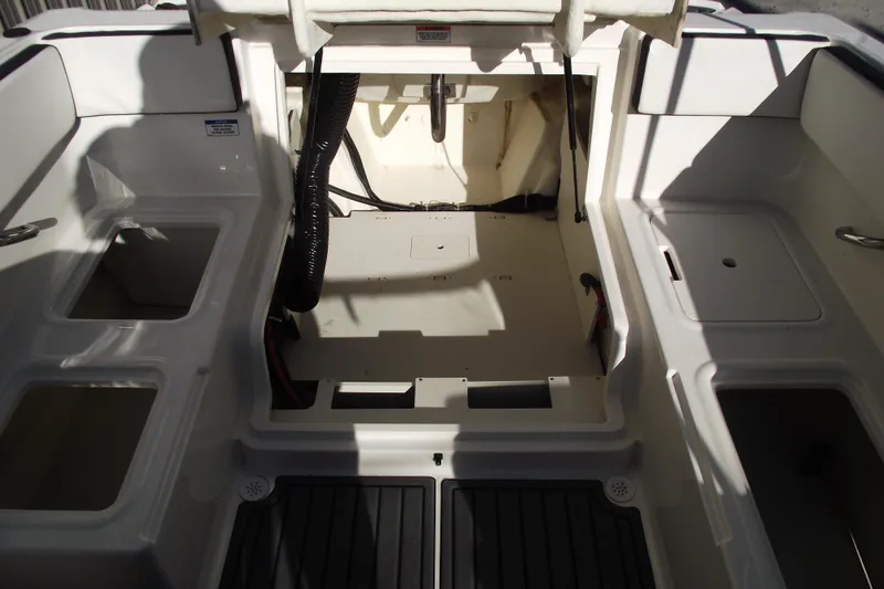 Slide: The Image of 2022 Bayliner VR4 Bowrider OB interior, showcasing storage compartments and seating layout. - 27